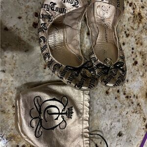 Size 7 gold Juicy Coture foldable flats with bag